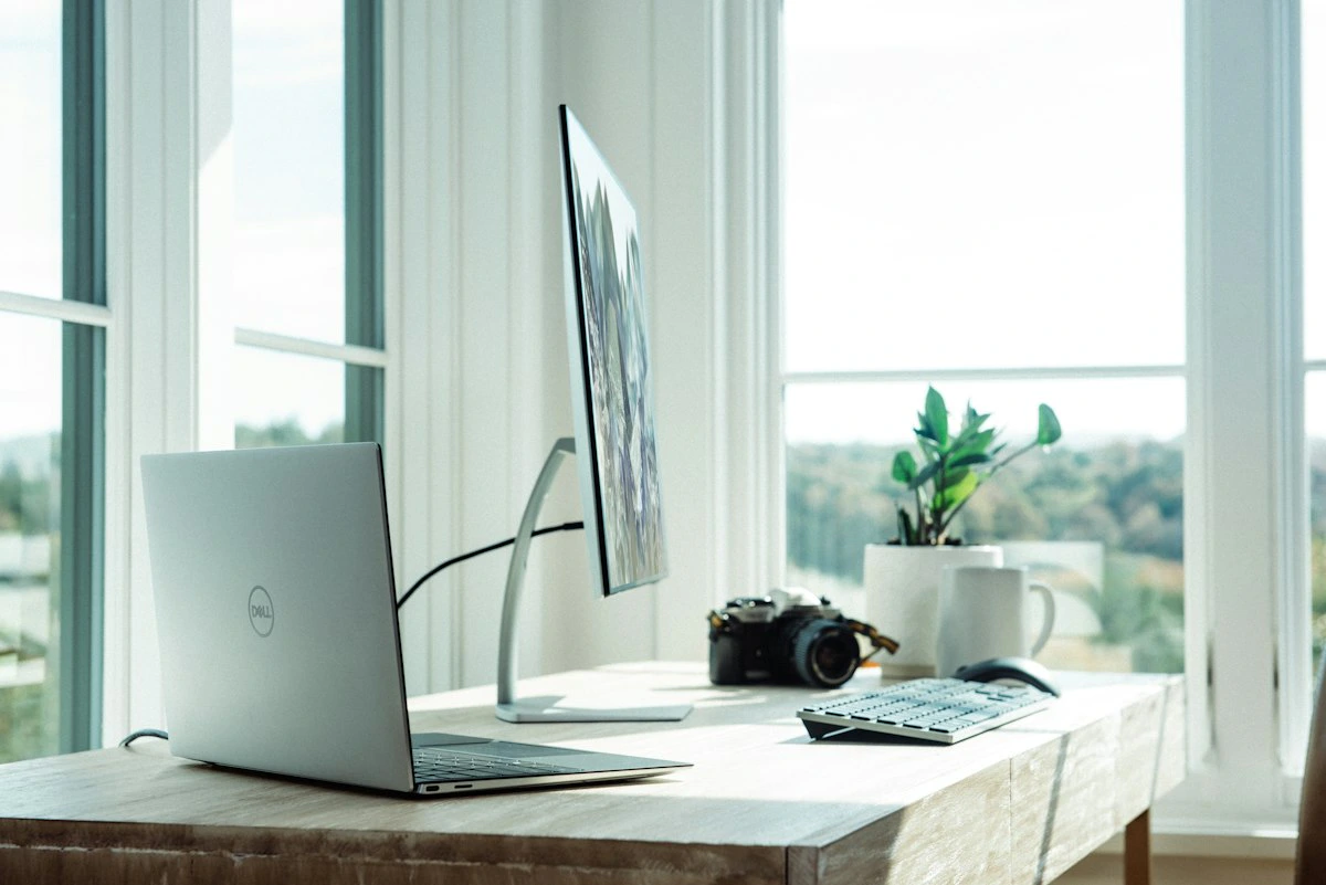 Working on a website layout on a laptop in a simple workspace