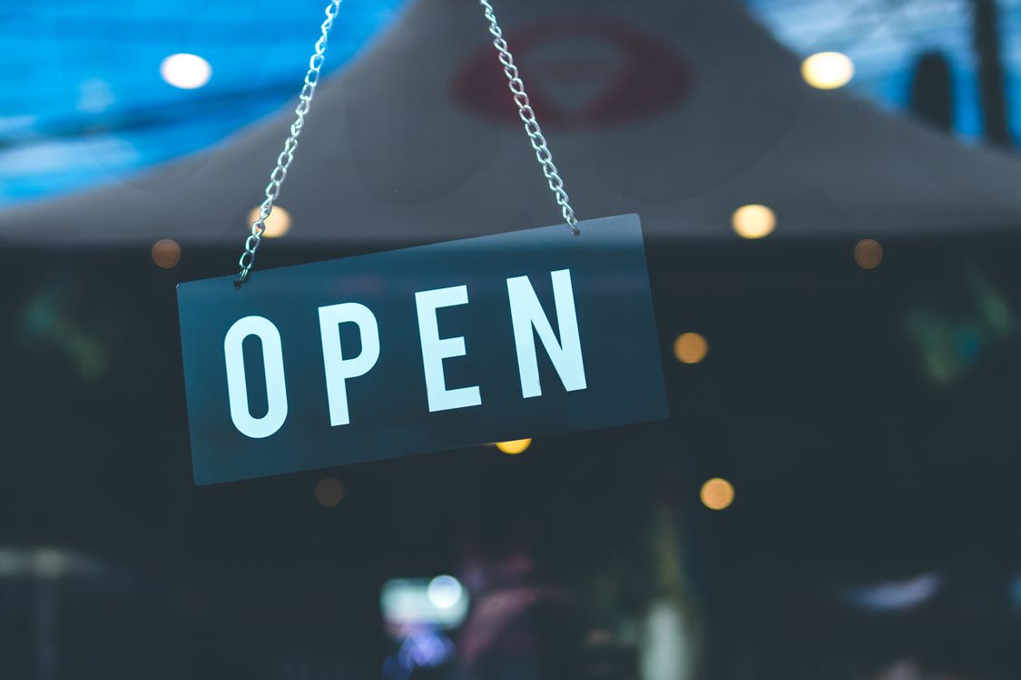 Small business owner outside their shopfront
