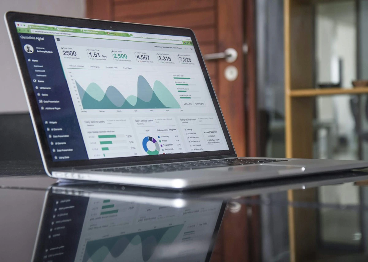 Website analytics dashboard shown on a laptop from above